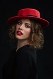 Studio portrait of young girl wearing red hat. royalty free stock photos Studio portrait of young girl wearing red hat. royalty free stock photos