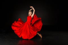 Studio shot of beautiful european girl in red dress stock images Studio shot of beautiful european girl in red dress stock images