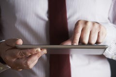 Studio Shot Of Businessman Using Digital Tablet royalty free stock photography Studio Shot Of Businessman Using Digital Tablet royalty free stock photography