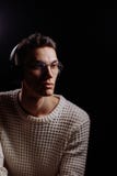 Studio shot of a handsome young male model wearing white T-shirt and sunglasses stock photography Studio shot of a handsome young male model wearing white T-shirt and sunglasses stock photography