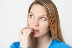 Studio Shot Of Nervous Woman Biting Nails royalty free stock image Studio Shot Of Nervous Woman Biting Nails royalty free stock image
