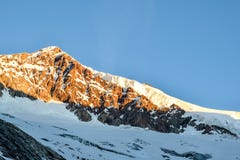 Stunning view of Aletschhorn 4193 m mountain in the Bernese Alps in Switzerland, Europe shortly after sunrise. Stock Photo Stunning view of Aletschhorn 4193 m mountain in the Bernese Alps in Switzerland, Europe shortly after sunrise. Stock Photo