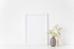 Cute summer white portrait a4 frame mock up with a episcopal weed in gray and white vases on white background. Mockup