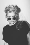 Stylish fashion sexy blonde bad girl in a black t-shirt and rock sunglasses covered with cigarette smoke. Dangerous Royalty Free Stock Photo Stylish fashion sexy blonde bad girl in a black t-shirt and rock sunglasses covered with cigarette smoke. Dangerous Royalty Free Stock Photo