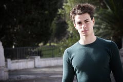 Stylish hair young man outdoors, tight knit intense light Royalty Free Stock Photography Stylish hair young man outdoors, tight knit intense light Royalty Free Stock Photography