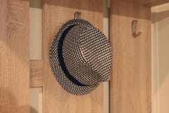 Stylish hat hanging on a hanger royalty free stock photography Stylish hat hanging on a hanger royalty free stock photography