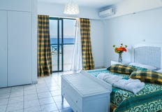 Stylish master bedroom in modern resort hotel in Greece royalty free stock photography Stylish master bedroom in modern resort hotel in Greece royalty free stock photography