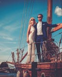 Stylish wealthy couple on a luxury yacht royalty free stock images Stylish wealthy couple on a luxury yacht royalty free stock images