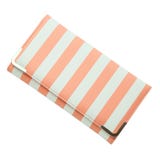 Stylish women`s purse pink striped isolated on the white background. Closeup of modern pink leather wallet over white stock images Stylish women`s purse pink striped isolated on the white background. Closeup of modern pink leather wallet over white stock images