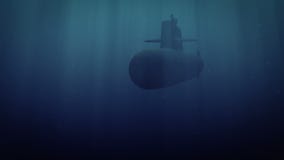 Submarine launching torpedos