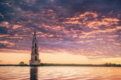 Submerged bell tower in river beautiful sunrise