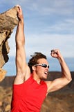 Success man climbing. Success concept - man climbing, hanging on edge showing strength and muscles. Strong successful male climber Success man climbing. Success concept - man climbing, hanging on edge showing strength and muscles. Strong successful male climber