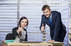 Successful business couple showing thumbs up Royalty Free Stock Image Successful business couple showing thumbs up Royalty Free Stock Image