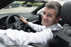 Successful businessman driving his car royalty free stock photography Successful businessman driving his car royalty free stock photography