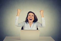 Successful girl with arms raised up using a laptop computer royalty free stock image Successful girl with arms raised up using a laptop computer royalty free stock image