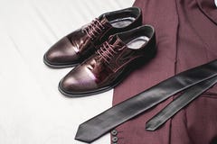 Suit, Necktie, Leather Shoes On A White Textile. Grooms Wedding Morning. Close Up Of Modern Man Accessories Royalty Free Stock Images Suit, Necktie, Leather Shoes On A White Textile. Grooms Wedding Morning. Close Up Of Modern Man Accessories Royalty Free Stock Images