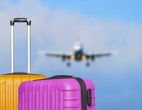 Suitcases And The Blure Boarding Plane In The Blue Sky. Stock Image