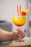 Cocktail sex on the beach in hand royalty free stock photo Cocktail sex on the beach in hand royalty free stock photo