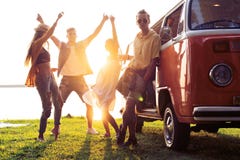 Summer holidays, road trip, vacation, travel and people concept - smiling young hippie friends having fun over minivan stock photos Summer holidays, road trip, vacation, travel and people concept - smiling young hippie friends having fun over minivan stock photos