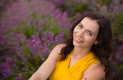 Summer portrait of young attractive woman in yellow dress sitting in blooming violet lavander field royalty free stock image Summer portrait of young attractive woman in yellow dress sitting in blooming violet lavander field royalty free stock image
