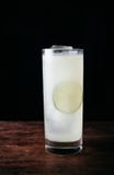 Alcoholic cocktail in a tall glass on dark background stock photos Alcoholic cocktail in a tall glass on dark background stock photos