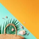 Summer Travel Concept With Women Straw Bag, Hat, Palm Leaves, Shells On Trendy Yellow And Green Background. Top View Royalty Free Stock Photography