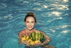 Summer vacation and travel to ocean. Dieting and healthy organic food, vegetarian. woman with tropical fruit in stock image Summer vacation and travel to ocean. Dieting and healthy organic food, vegetarian. woman with tropical fruit in stock image