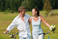 Summer - Young Couple With Old Bike In Meadow Stock Image Summer - Young Couple With Old Bike In Meadow Stock Image