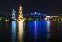 The Sun and Moon Twin Pagodas illuminated at night in the city of Guilin, China royalty free stock photo The Sun and Moon Twin Pagodas illuminated at night in the city of Guilin, China royalty free stock photo