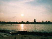 Sun over Coastal Cityscape Stock Photos Sun over Coastal Cityscape Stock Photos