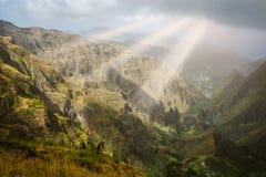 Sun Rays Coming Through The Clouds In Rocky Mountain Landscape Of In Xo-xo Valley In Santo Antao Island, Cape Verde Royalty Free Stock Photo