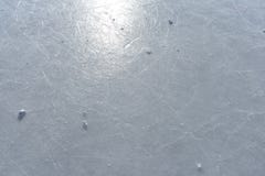 Sun reflecting in the surface of an ice rink