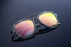 Sunglasses, chameleon color, shimmer in the sun. dark gradient background. royalty free stock photography Sunglasses, chameleon color, shimmer in the sun. dark gradient background. royalty free stock photography