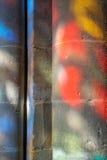 Sunlight through stained glass on pillars of a church stock photography Sunlight through stained glass on pillars of a church stock photography