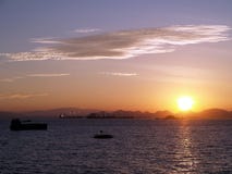 dawn sunrise, first light of day on the horizon over the sea stock photos dawn sunrise, first light of day on the horizon over the sea stock photos