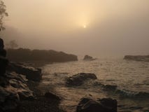 Sunrise and morning fog on the lake