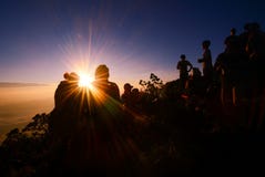 Sunrise at mountain with silhouette people and couple success to royalty free stock images Sunrise at mountain with silhouette people and couple success to royalty free stock images