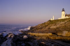 Sunrise By Pemaquid Lighthouse Over Unique Geological Rock Formations in Maine royalty free stock photos Sunrise By Pemaquid Lighthouse Over Unique Geological Rock Formations in Maine royalty free stock photos