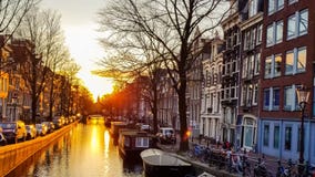 Sunset on the Amsterdam canal stock footage Sunset on the Amsterdam canal stock footage