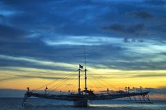Sunset with boat views on the beach royalty free stock photography Sunset with boat views on the beach royalty free stock photography