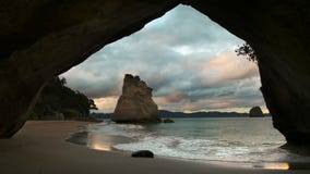 Sunset at cathedral cove in new zealand stock video Sunset at cathedral cove in new zealand stock video