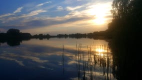 Sunset over the lake royalty free stock photos