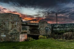 Sunset in the medieval city. Medieval bridge under fiery sky royalty free stock image Sunset in the medieval city. Medieval bridge under fiery sky royalty free stock image