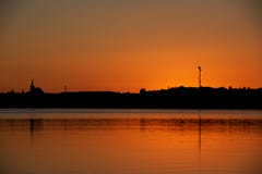 Sunset near Reykjavik with city silhouette reflecting in the wat Royalty Free Stock Image Sunset near Reykjavik with city silhouette reflecting in the wat Royalty Free Stock Image