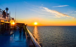 Sunset On The Sea Between Germany And Denmark On The Fehmarnbelt Waterway, With A View From Aboard A Passenger Ship Stock Photo Sunset On The Sea Between Germany And Denmark On The Fehmarnbelt Waterway, With A View From Aboard A Passenger Ship Stock Photo