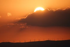Sunset over mountains with modern windmills royalty free stock image Sunset over mountains with modern windmills royalty free stock image