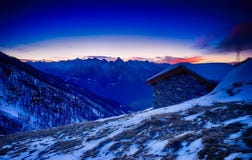 Sunset over snowy mountain cabin Stock Photography Sunset over snowy mountain cabin Stock Photography