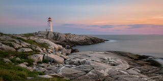 Peggy`s Point Lighthouse at sunset stock image Peggy`s Point Lighthouse at sunset stock image