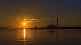 Sunset at power plant. Timelapse