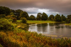 Sunset in the rain at the lake stock photos Sunset in the rain at the lake stock photos